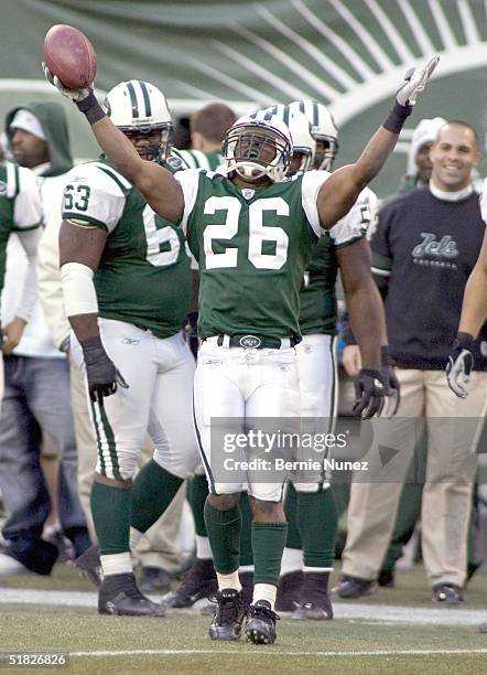 Erik Coleman of the New York Jets celebrates an interception against the Houston Texans on December 5, 2004 at Giants Stadium in East Rutherford, New...