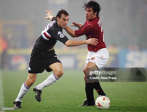 Cristian Zenoni of Sampdoria attempts to control the ball from Gaetano D'Agostino of Roma during the Serie A: Roma v Sampdoria match on December 5,...