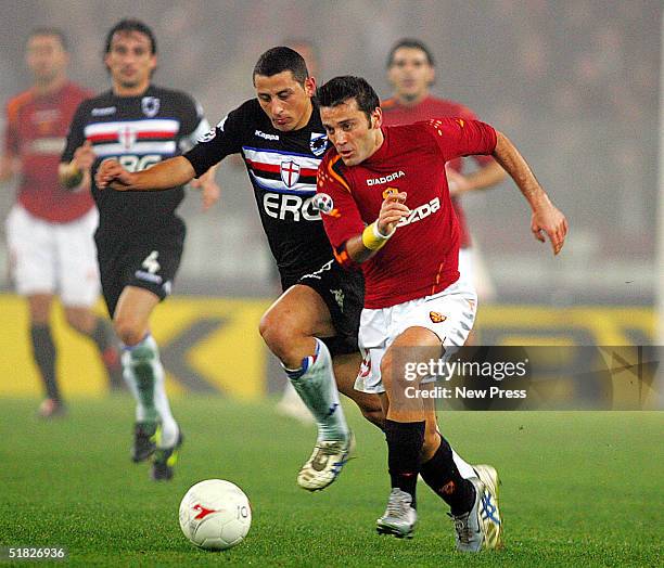 Angelo Palombo of Sampdoria attempts to control the ball from Vincenzo Montella of Roma during the Serie A: Roma v Sampdoria match on December 5,...