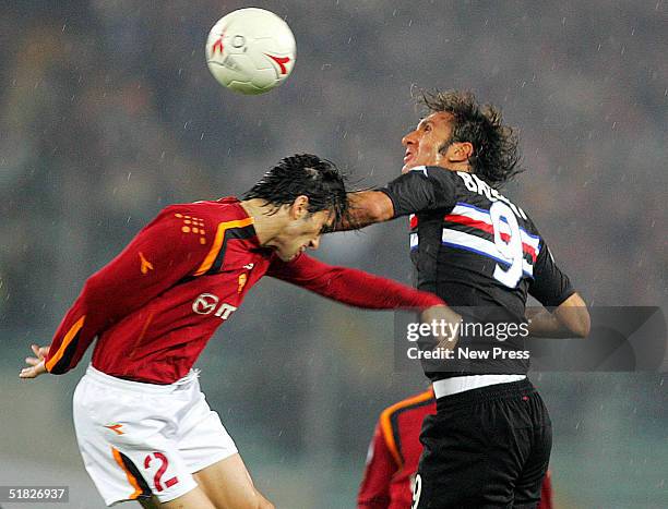 Christian Panucci of Roma attempts to control the ball from Fabio Bazzani of Sampdoria during the Serie A: Roma v Sampdoria match on December 5, 2004...