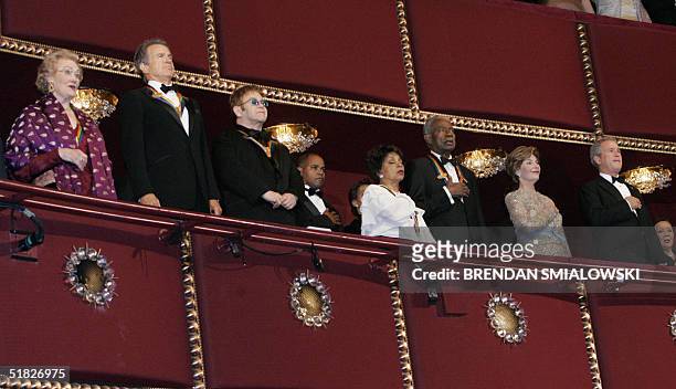 President George W Bush and First Lady Laura Bush listen with honorees to the National Anthem during the 27th annual Kennedy Center Honors 05...