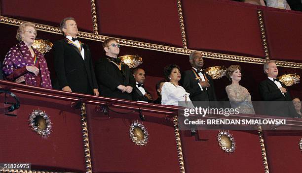 President George W Bush and First Lady Laura Bush listen with honorees to the National Anthem during the 27th annual Kennedy Center Honors 05...