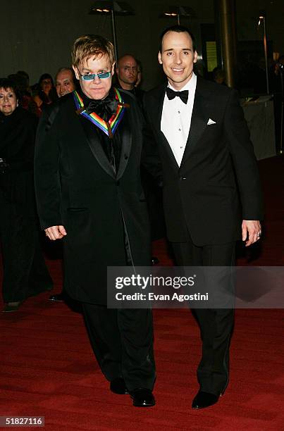 Honoree Sir Elton John and partner David Furnish arrive at the 27th Annual Kennedy Center Honors Gala at The Kennedy Center for the Performing Arts...