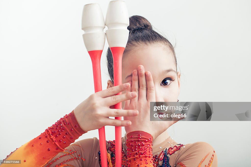 Girl is engaged in rhythmic gymnastics