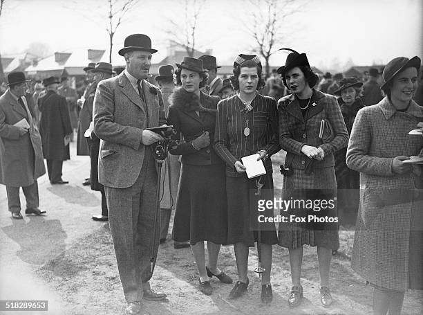 Spectators at the spring race meeting at Newbury Racecourse, Berkshire, 31st March 1939. Left to right: Edward Digby, 11th Baron Digby , Osla Benning...