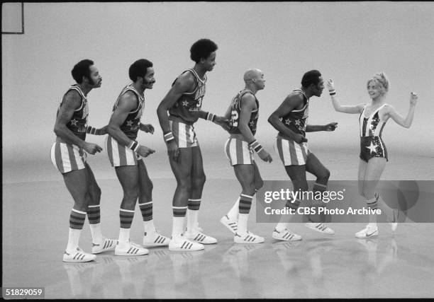 American actress Goldie Hawn performs with the Harlem Globetrotters, including Robert Paige , Curley Neal and Meadowlark Lemon , during the CBS...