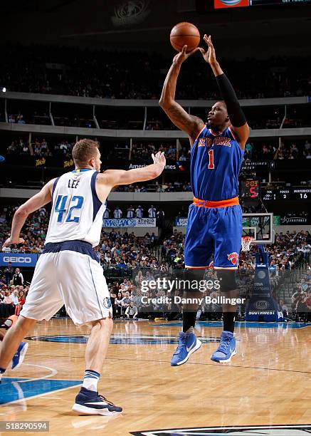 Kevin Seraphin of the New York Knicks shoots a jumper against the Dallas Mavericks on March 30, 2016 at the American Airlines Center in Dallas,...