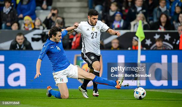 Kevin Volland of Germany is challenged by Matteo Darmian of Italy during the International Friendly match between Germany and Italy at Allianz Arena...