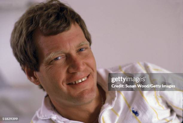 Portrait of American talk show host David Letterman smiling at his home, Westchester County, New York, March 1984.