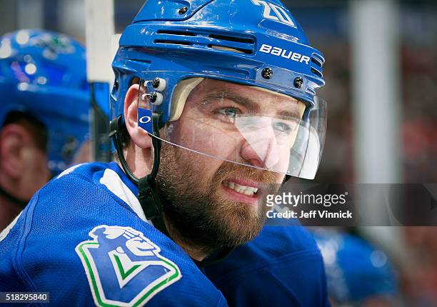Chris Higgins of the Vancouver Canucks looks on from the bench during their NHL game against the Chicago Blackhawks at Rogers Arena March 27, 2016 in...