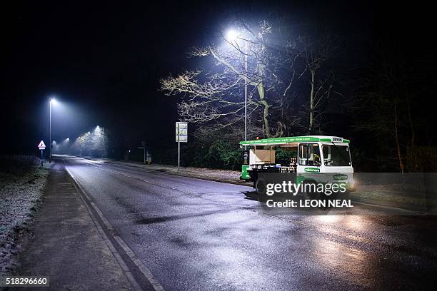 Neil Garner, a milkman for the Milk&More delivery company, works on his daily round in the Watford area, north of London, on January 21, 2016. Once a...