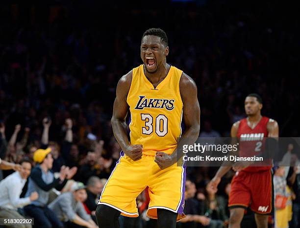 Julius Randle of the Los Angeles Lakers celebrates after defeating the Miami Heat,102-100, in overtime at Staples Center March 30 in Los Angeles,...