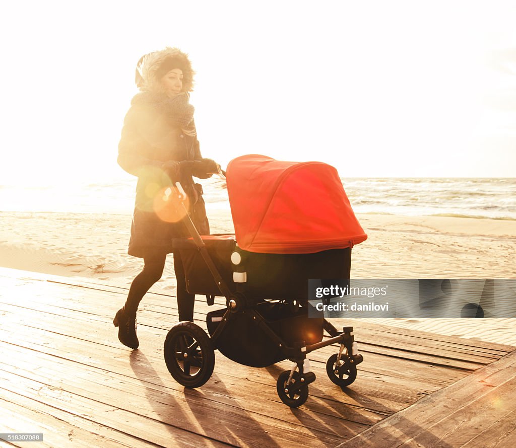 Young mother with stroller