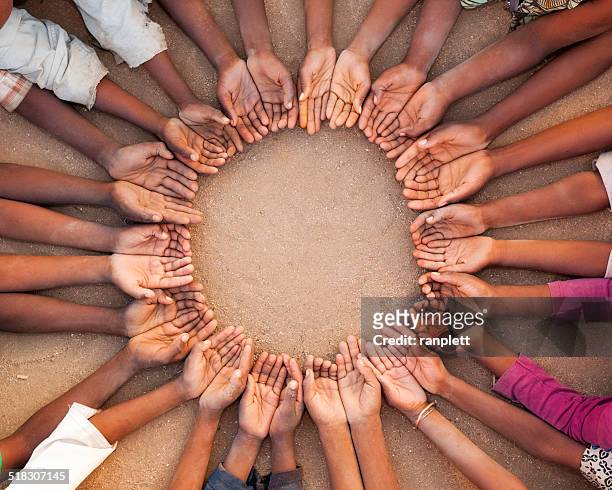 african chidren's hands - all you need is love stockfoto's en -beelden