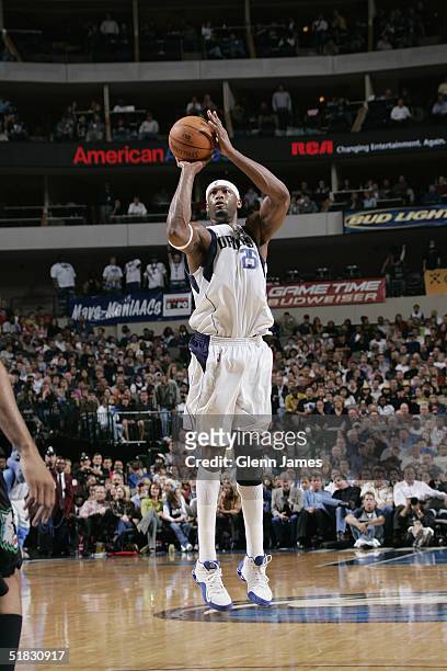 Erick Dampier of the Dallas Mavericks shoots against the Minnesota Timberwolves November 22, 2004 at the American Airlines Center in Dallas, Texas....