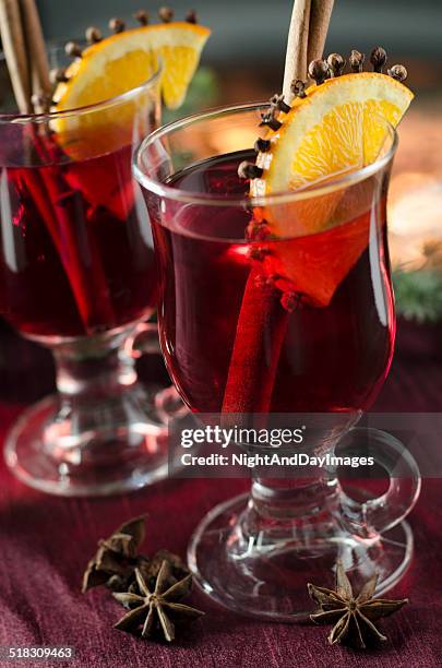 warm spiced wine by the fire - glogg stock pictures, royalty-free photos & images