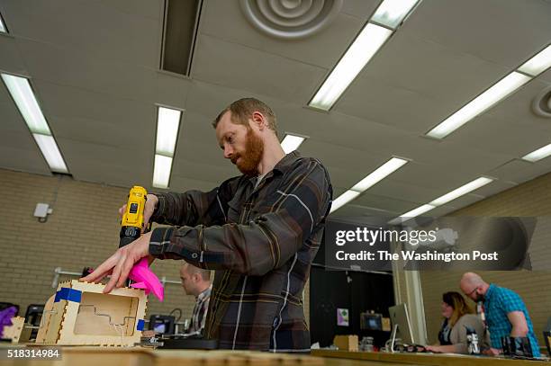Jared Nielsen DC, creates a mechanical automata in the Fab Lab at the Martin Luther King Jr. Memorial Library on March 10, 2016 in Washington, DC.