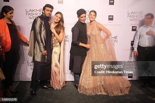 Indian Fashion designer Manish Malhotra with Bollywood actors Kareena Kapoor Khan, Arjun Kapoor and Jacqueline Fernandez during the opening show of...