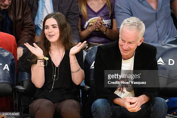 John McEnroe and Ava McEnroe attend a basketball game between the Miami Heat and the Los Angeles Lakers at Staples Center on March 30, 2016 in Los...