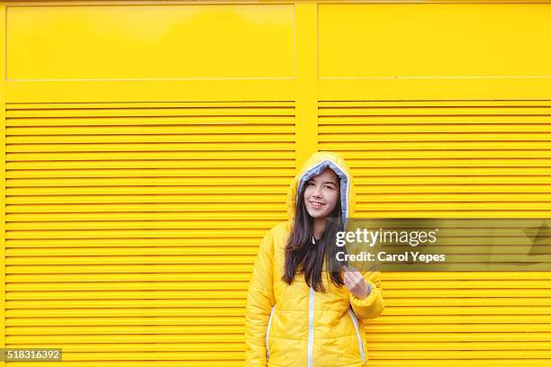 yellow - girl oilskin stock pictures, royalty-free photos & images