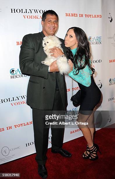 Former Baseball player Jose Conseco with dog Chloe and model Leila Knight arrive for the 2nd Annual Babes In Toyland - Pet Edition held at Avalon on...