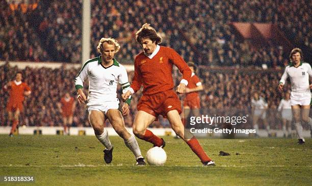 Borussia Mönchengladbach full back Berti Vogts challenges Liverpool winger Steve Heighway during the European Cup Semi Final 2nd leg match at Anfield...