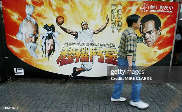 Man walks past a Nike advertisment featuring NBA player LeBron James in Hong Kong, 07 December 2004. China has imposed a nationwide ban on a...