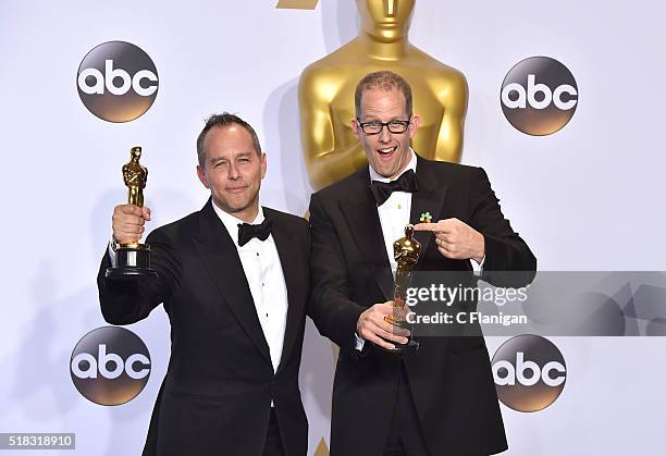 Filmmakers Jonas Rivera and Pete Docter, winners of the Best Animated Feature award for 'Inside Out,' pose in the press room during the 88th Annual...
