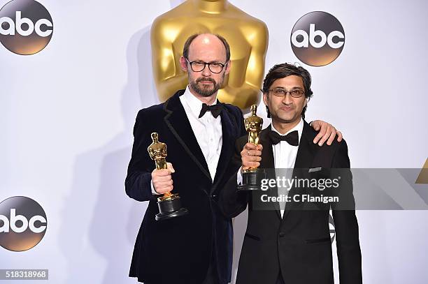 Filmmakers James Gay-Rees and Asif Kapadia, winners of the Best Documentary Feature award for 'Amy,' pose in the press room during the 88th Annual...