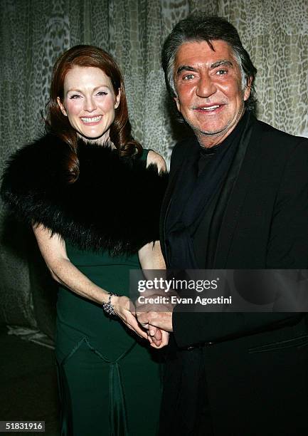 Fashion designer Roberto Cavalli and actress Julianne Moore attend a preview gala dinner for the Metropolitan Museum's "Wild: Fashion Untamed"...