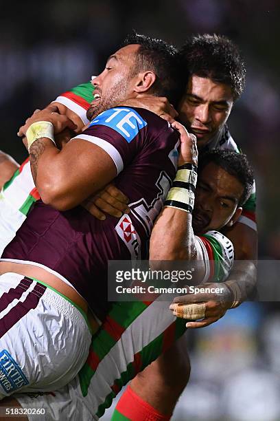 Feleti Mateo of the Sea Eagles is tackled during the round five NRL match between the Manly Sea Eagles and the South Sydney Rabbitohs at Brookvale...