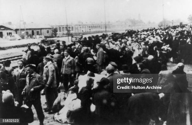 Jewish deportees arriving at the railway terminus at the Nazi concentration camp at Auschwitz, Poland, circa 1942.