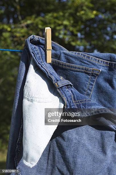 jeans on the clothesline - inside out stock pictures, royalty-free photos & images