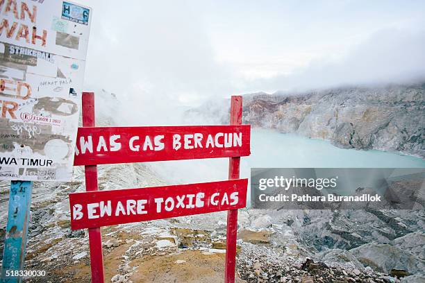 warning sign at kawah ijen - fire and brimstone stock-fotos und bilder