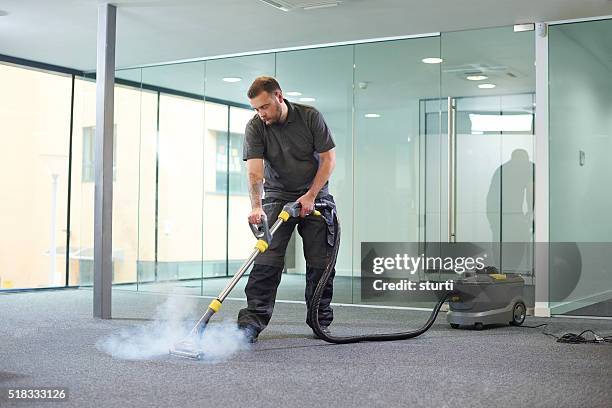 steam cleaning the office carpet - vacuum cleaner stock pictures, royalty-free photos & images