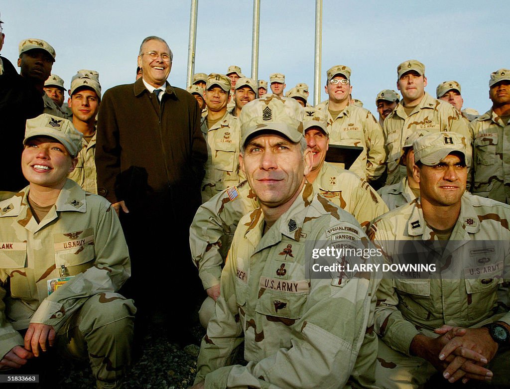 Secdef Rumsfeld US Secretary of Defense Donald Rumsfeld poses with US military... News ...