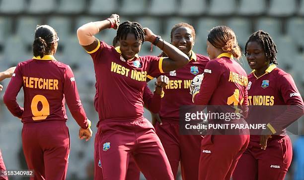 West Indies Shamilia Connell celebrates with teammates after taking the wicket of New Zealand batsman Rachel Priest during the World T20 women's...