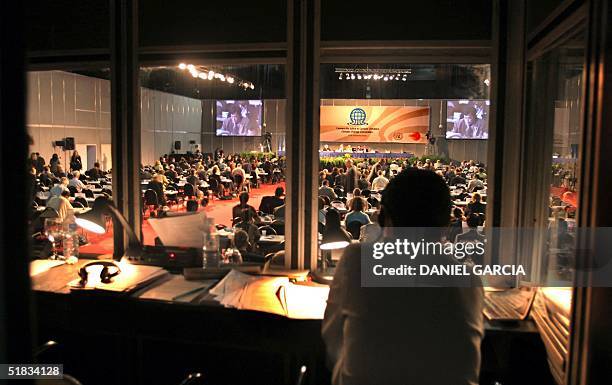 Translator does his job while a convention's delegate addresses the plenary during the second day of the 10h Session of the Conference of the Parties...