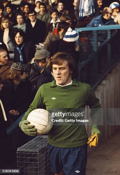 Derby County goalkeeper Colin Boulton complete with gloves and cap, enters the pitch at a match circa 1972.