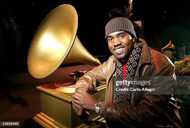 Rapper Kanye West poses for photos after receiving 10 Grammy nominations at the 47th Annual GRAMMY Awards at The Music Box December 7, 2004 in...