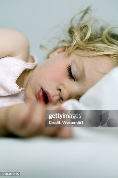 germany, berlin, blond girl sleeping - toddler sleeping stock pictures, royalty-free photos & images