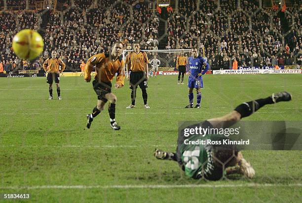 Kevin Cooper of Wolves scores past Andy Marshall of Millwall from the penalty spot during the Coca-cola Championship match between Wolverhampton...