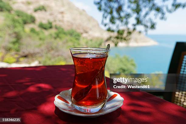 turkey, anatolia, akdamar island, cay, glass of turkish tea - cay stock pictures, royalty-free photos & images