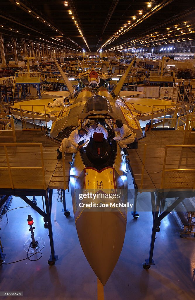 Employeez work on the end of the assembly line in a Lockheed Martin ...