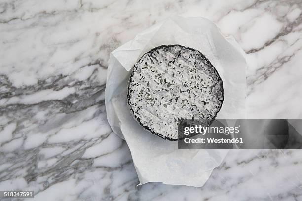 french goat cheese with ash rind - mottled skin stockfoto's en -beelden