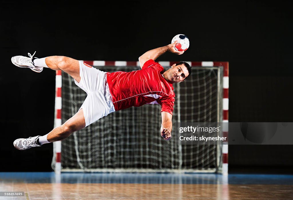 Male handball player in action.