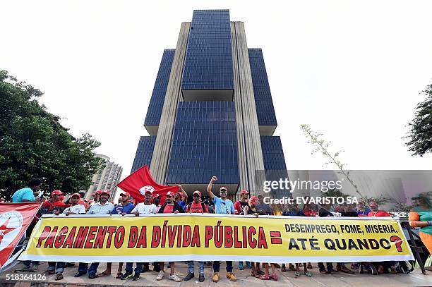 Members of the Frente Nacional de Luta, Campo e Cidade protest in front of the Central Bank of Brazil in Brasilia, against the payment of the public...