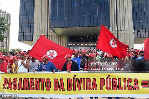 Members of the Frente Nacional de Luta, Campo e Cidade protest in front of the Central Bank of Brazil in Brasilia, against the payment of the public...