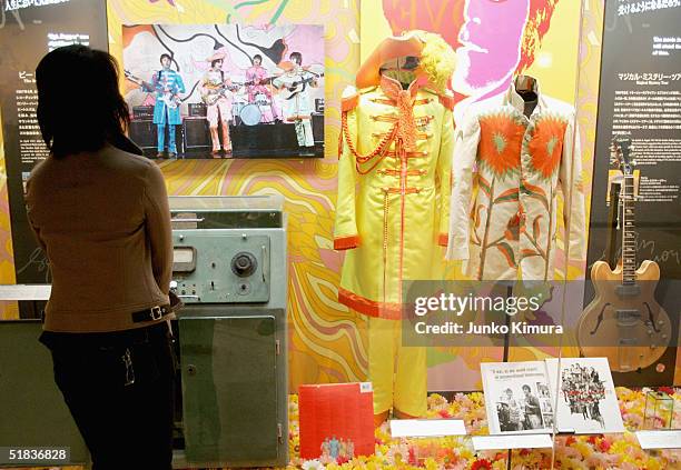 Japanese fan looks at memorabilia from The Beatles at the John Lennon Museum on December 8, 2004 in Saitama, Japan. Fans gathered at the museum to...