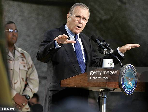 Secretary of Defense Donald Rumsfeld addresses U.S. Military personnel before their scheduled departure to Iraq December 8, 2004 at Camp Buehring in...